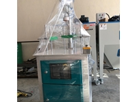 Machine de test de trous pour bidons en plastique - 1