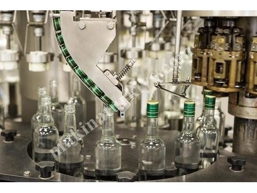 Machine de plastérisation de capsules en aluminium pour bouteilles en verre