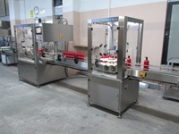 Machine de remplissage et fermeture de liquides servo de 100 ml à 1000 ml - 1