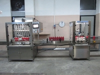 Machine de remplissage et de capsulage de liquides servo de 100 ml à 1000 ml - 1