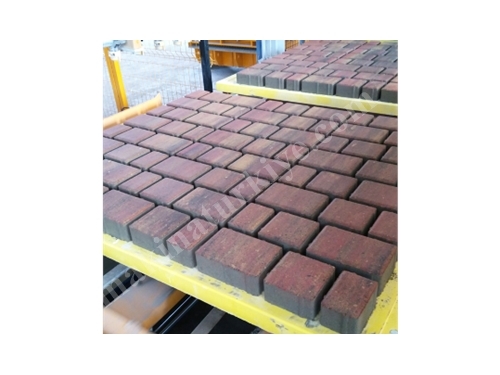 Système de mélange et de coloration de pavés en blocs de béton briquette
