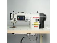 Machine à coudre à zigzag avec sac à étrier plein d'huile