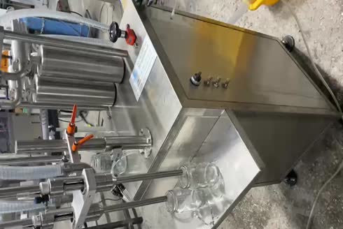 400-600 Pcs/Hour Double Nozzle Semi-Automatic Volumetric Liquid Filling Machine